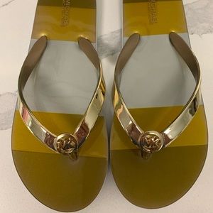 Michael Kors Shiny Metallic Gold Flip Flops